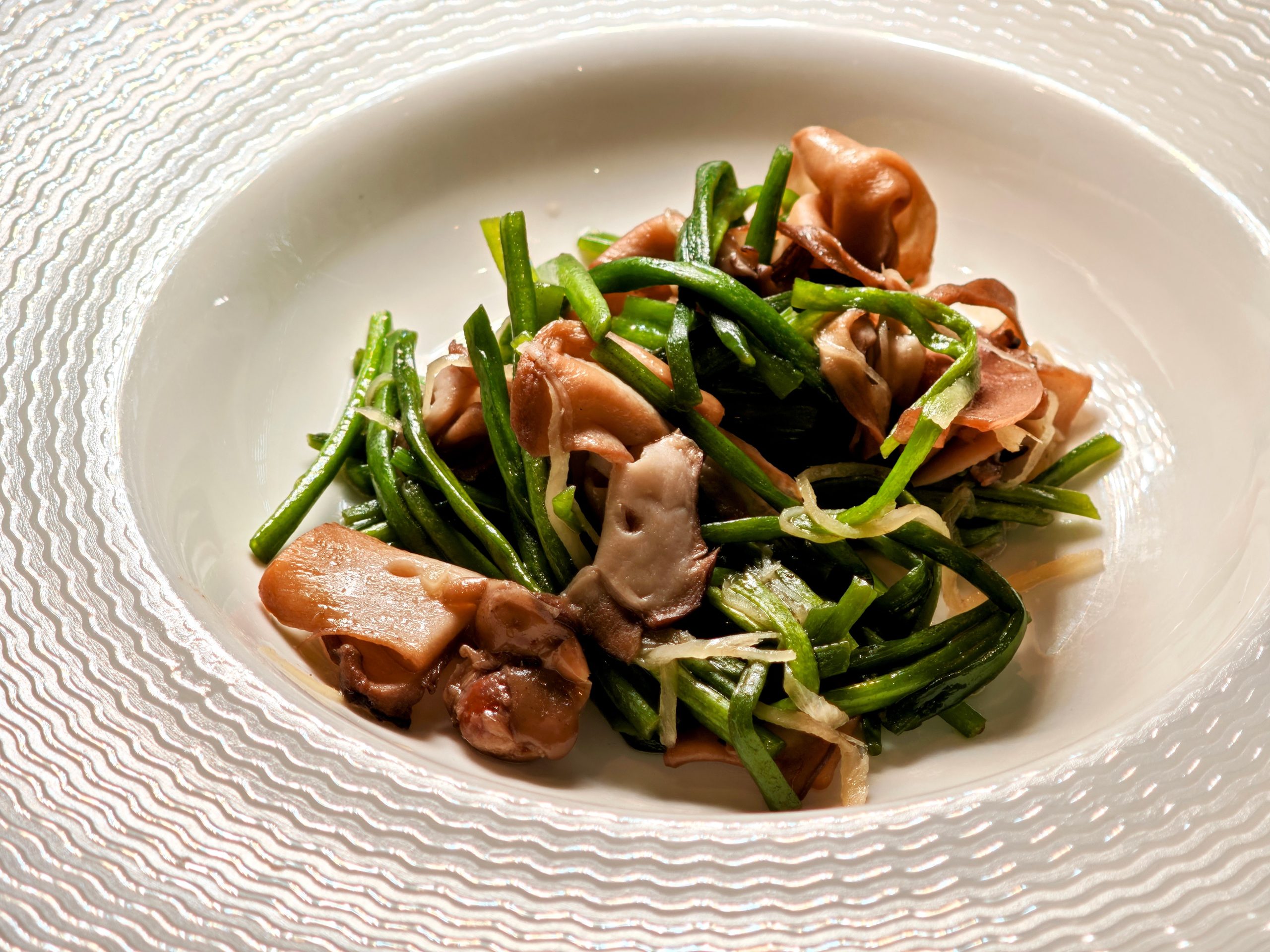 Stir-fried Water Lily Stem with Cordia Dichotoma served with Crispy Oyster Mushroom