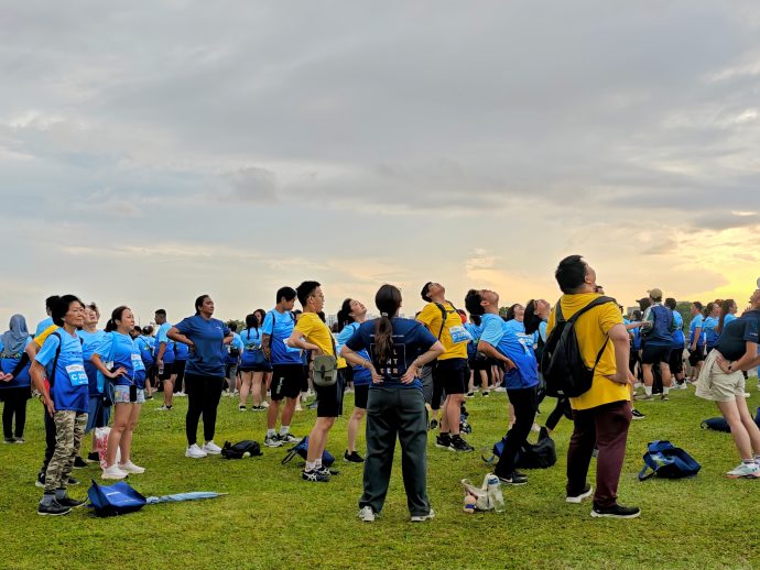 Participants warming up at the Skechers Friendship Walk and Run 2026 at Marina Barrage in Singapore on 7 June 2026