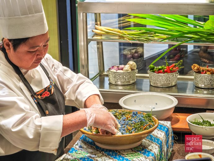 Madam Cheah Soo Fuen making Nasi Ulam