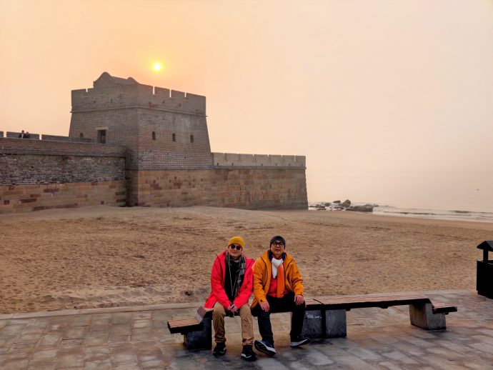 Travellers posing at Laolongtou Old Dragon Head Great Wall in Qinhuangdao Hebei