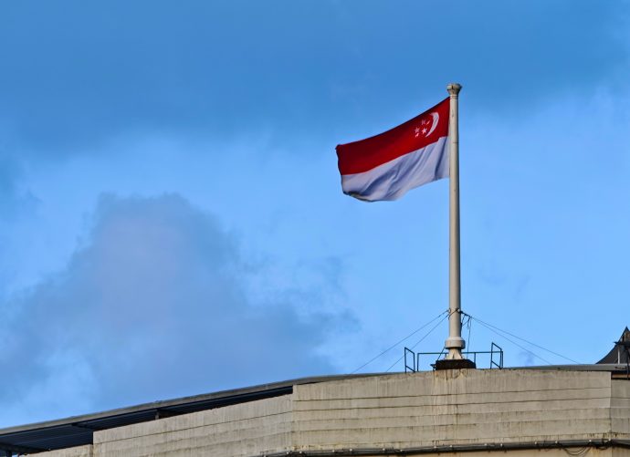 Singapore Flag on pole above building | SUPERADRIANME.com Singapore Flag on pole above building