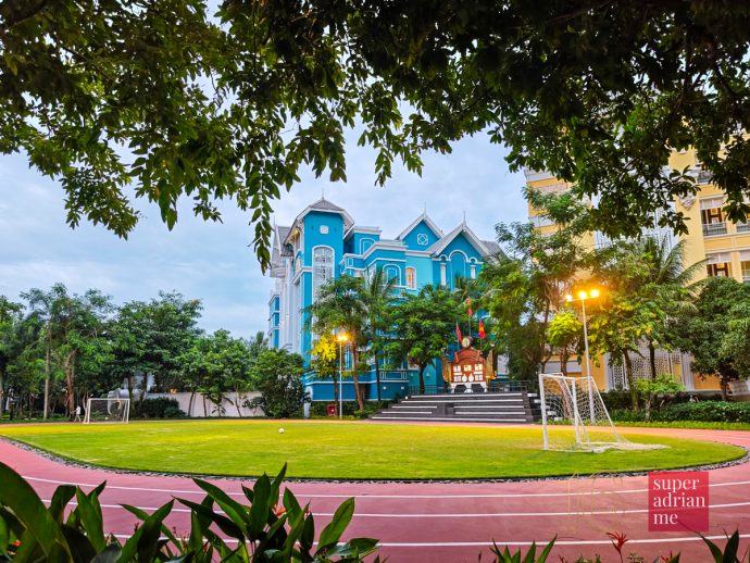 SUPERADRIANME - JW Marriott Phu Quoc Emerald Bay - July 2026 -181937 | SUPERADRIANME.com Running track loops around a grass football pitch near the centre of JW Marriott Phu Quoc Emerald Bay